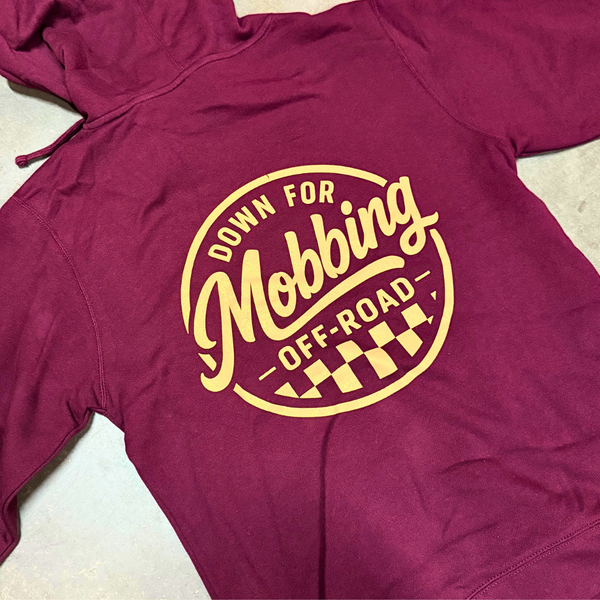 Maroon Heritage Hoodie from Maroonie laid flat, showing clay screenprinted circle checkered logo on back with 'Down For Dust -Off-Road-' text and vintage flag border, heavyweight fleece pullover